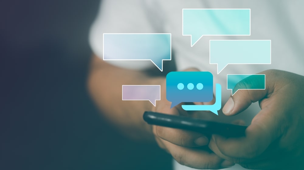 Person texting with a graphic of messages illustrating dynamic autoresponders.